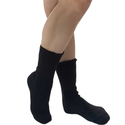 Extra wide black thermal socks featuring fluffy fold-over cuff for warmth and comfort.
