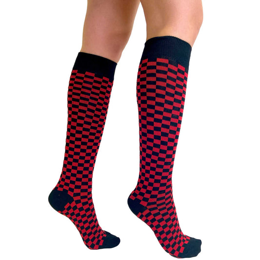 Red and black checkerboard knee-high socks for women featuring a bold optical illusion pattern and comfortable stretch fit by Malka Chic.