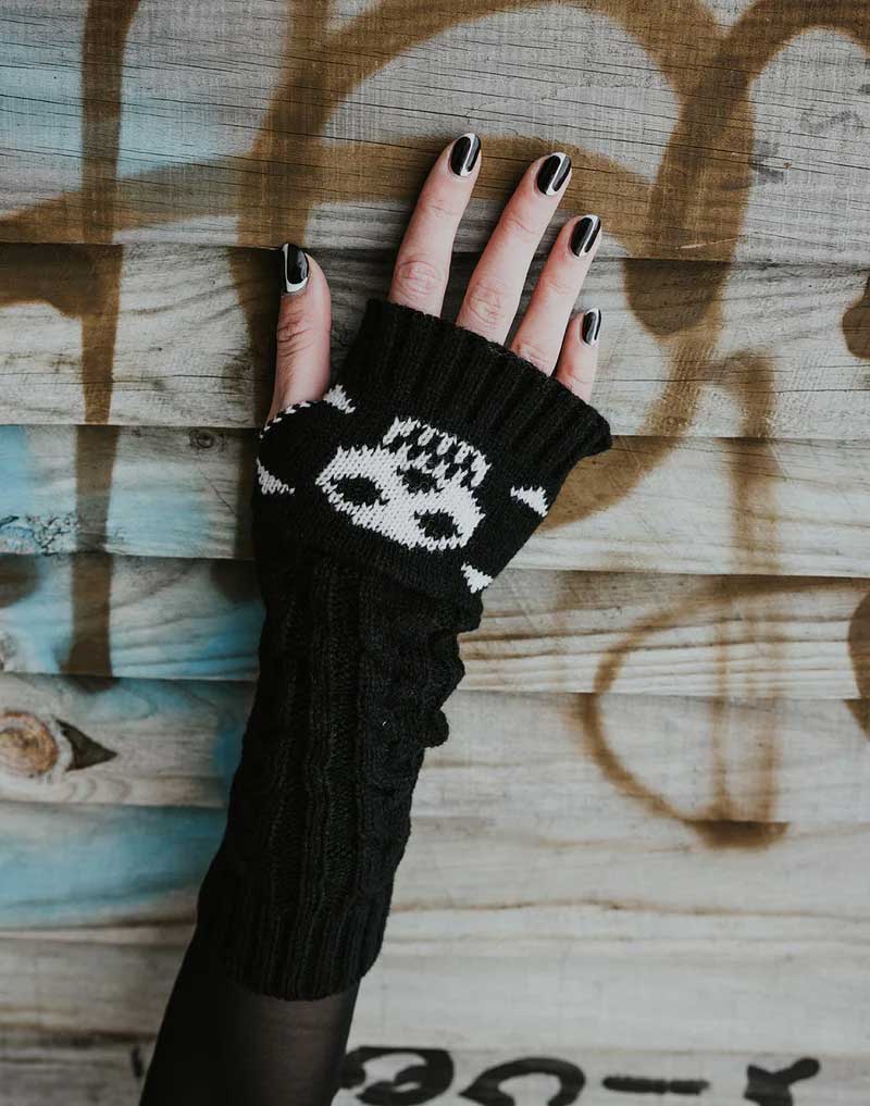 Long knitted skull and crossbones arm warmers by Malka Chic for gothic, punk and alternative fashion.