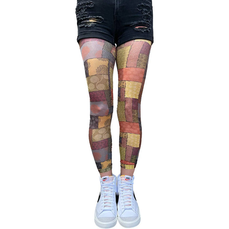 Patchwork patterned tights by Malka Chic with vibrant African inspired print