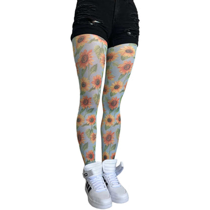 Yellow sunflower patterned tights for women by Malka Chic, floral hosiery adding fun and positive style to outfits.