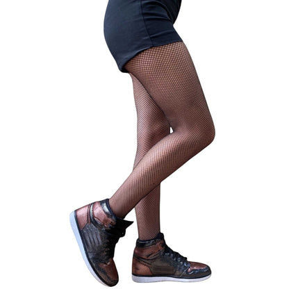 Women wearing black fishnet pantyhose styled with sneakers and shorts