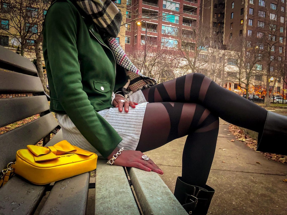 Black geometric illusion tights for women with bold sheer and opaque panels for a stylish fashion look.
