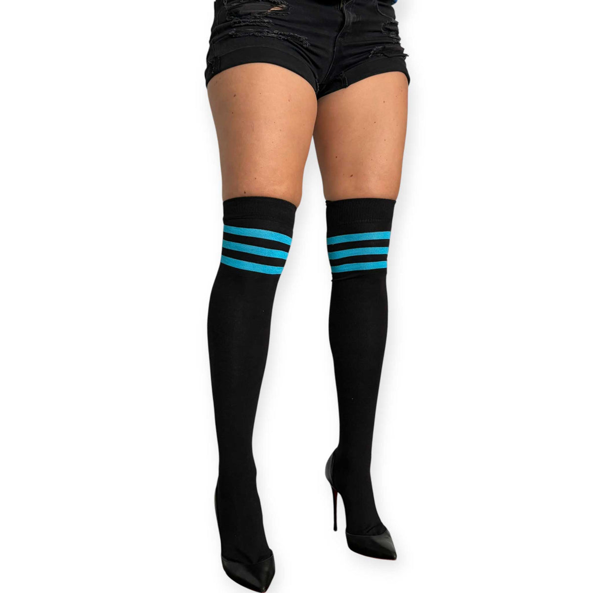 Malka Chic black thigh high socks for women with turquoise stripe detail, styled with black shorts and black heels.
