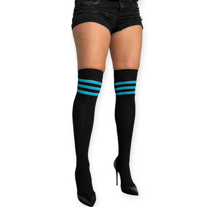 Malka Chic black thigh high socks for women with turquoise stripe detail, styled with black shorts and black heels.