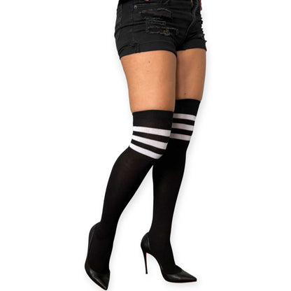 Women’s black and white striped knee high socks by Malka Chic styled with black shorts and heels.