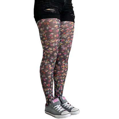 Sheer black tights with ditsy floral print by Malka Chic, elegant patterned hosiery for dresses and skirts.