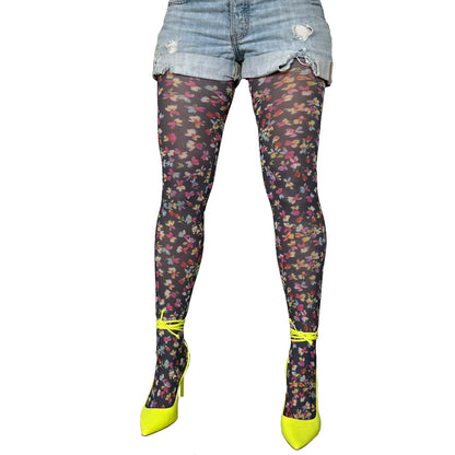 Black floral patterned tights for women by Malka Chic with small ditsy flowers for a soft and feminine look.