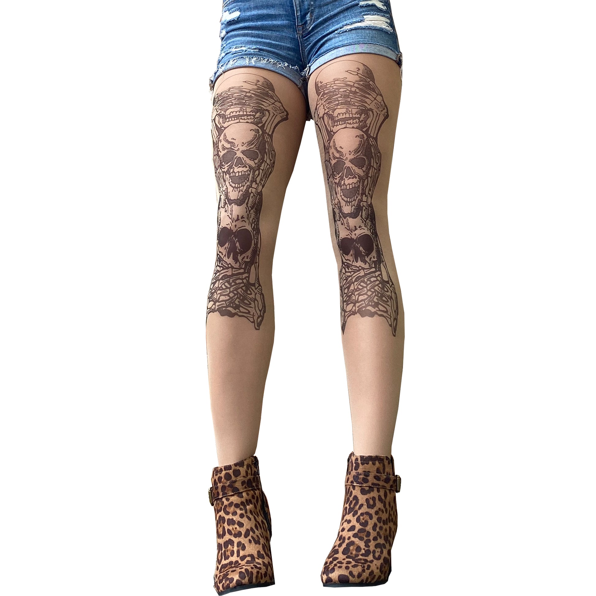 Women's sheer nude tights with realistic three skull tattoo design on both legs, gothic statement hosiery by Malka Chic.
