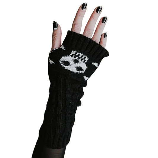Women's black knit fingerless gloves featuring white skull and crossbones pattern.