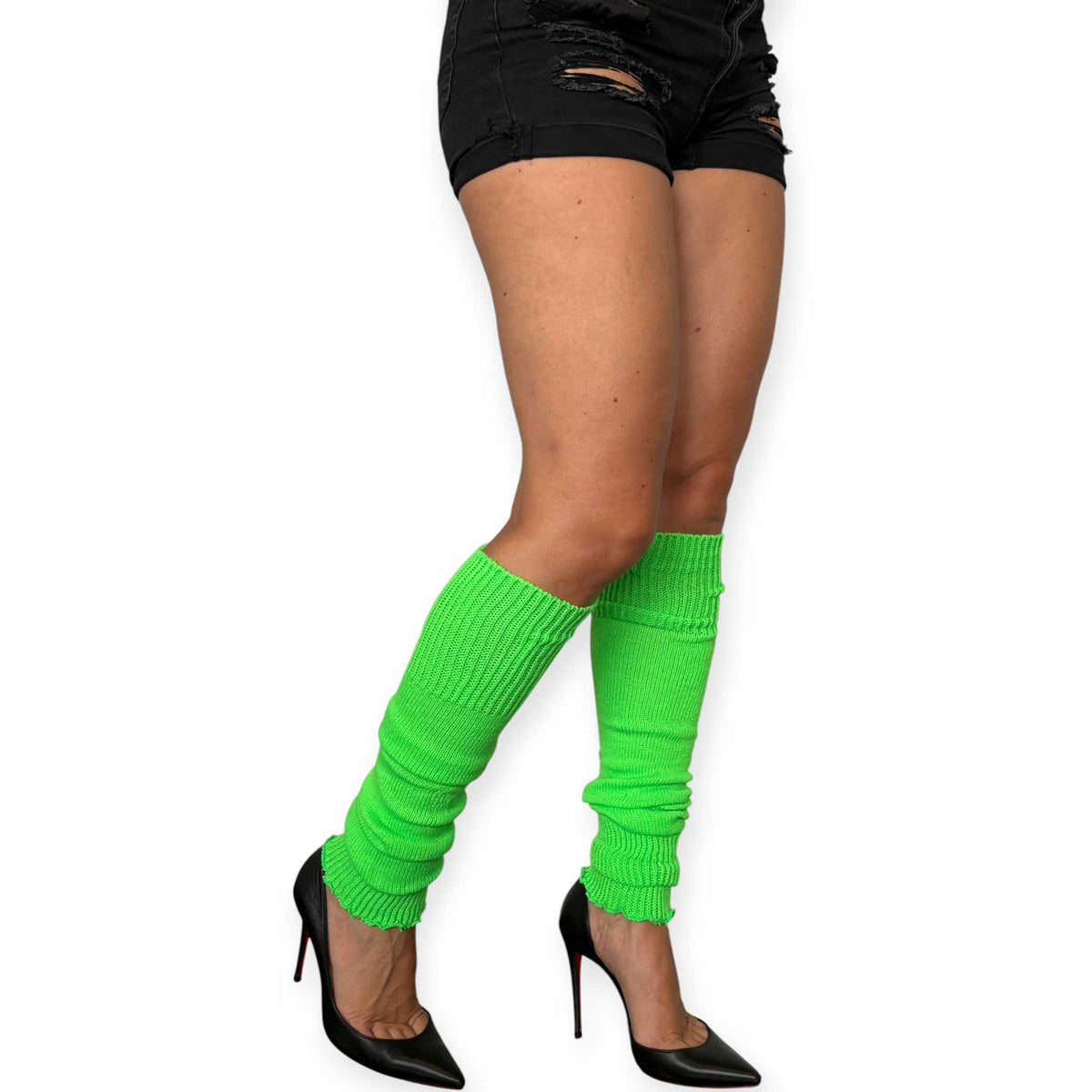 Lime green knitted leg warmers styled as a bold fashion accessory.