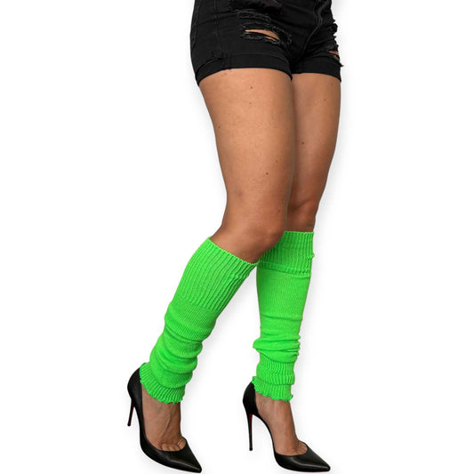 Lime green knitted leg warmers styled as a bold fashion accessory.