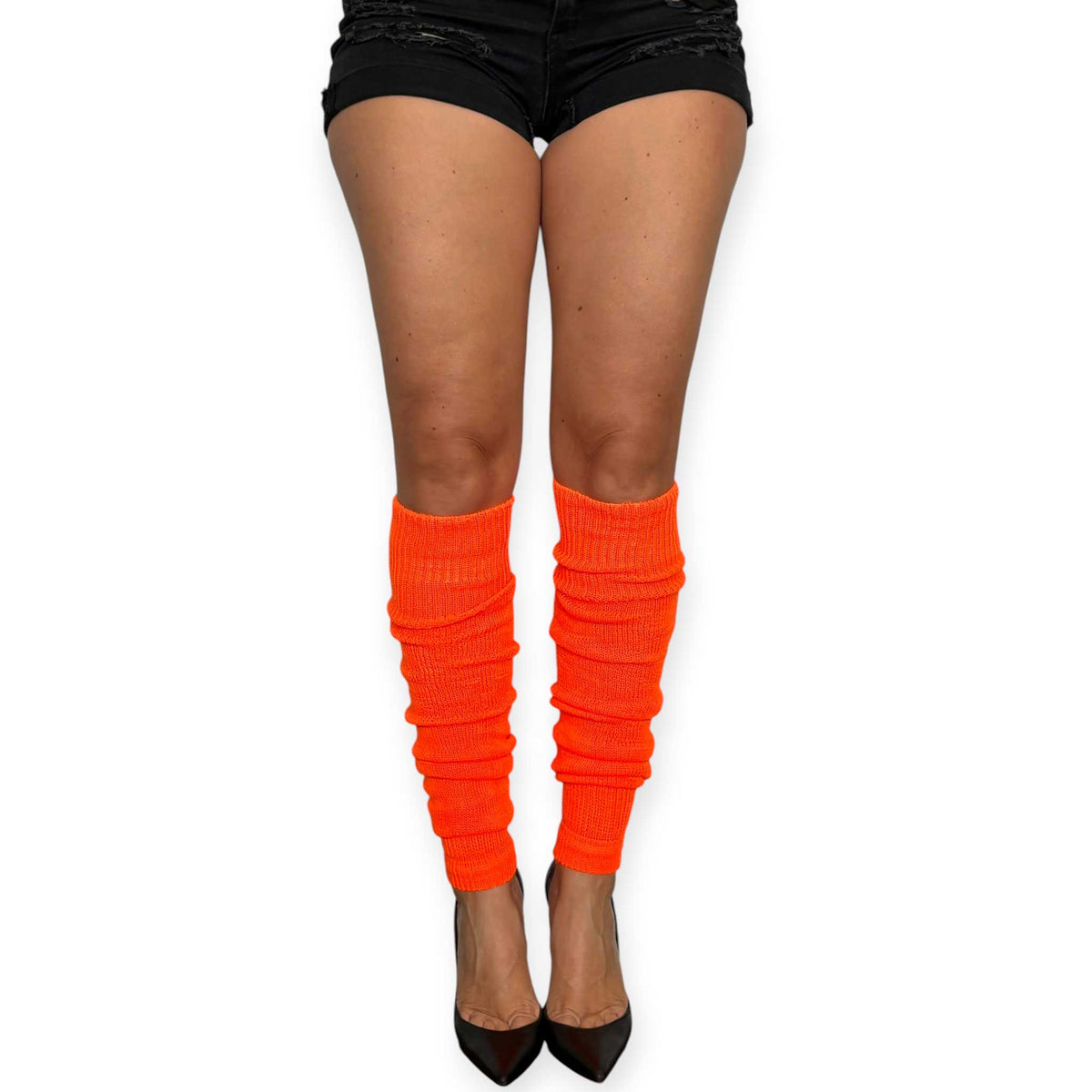 Bright orange leg warmers worn slouched with colorful heels.