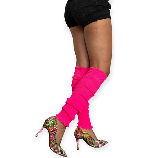 Neon pink knit leg warmers for women styled with floral high heels.