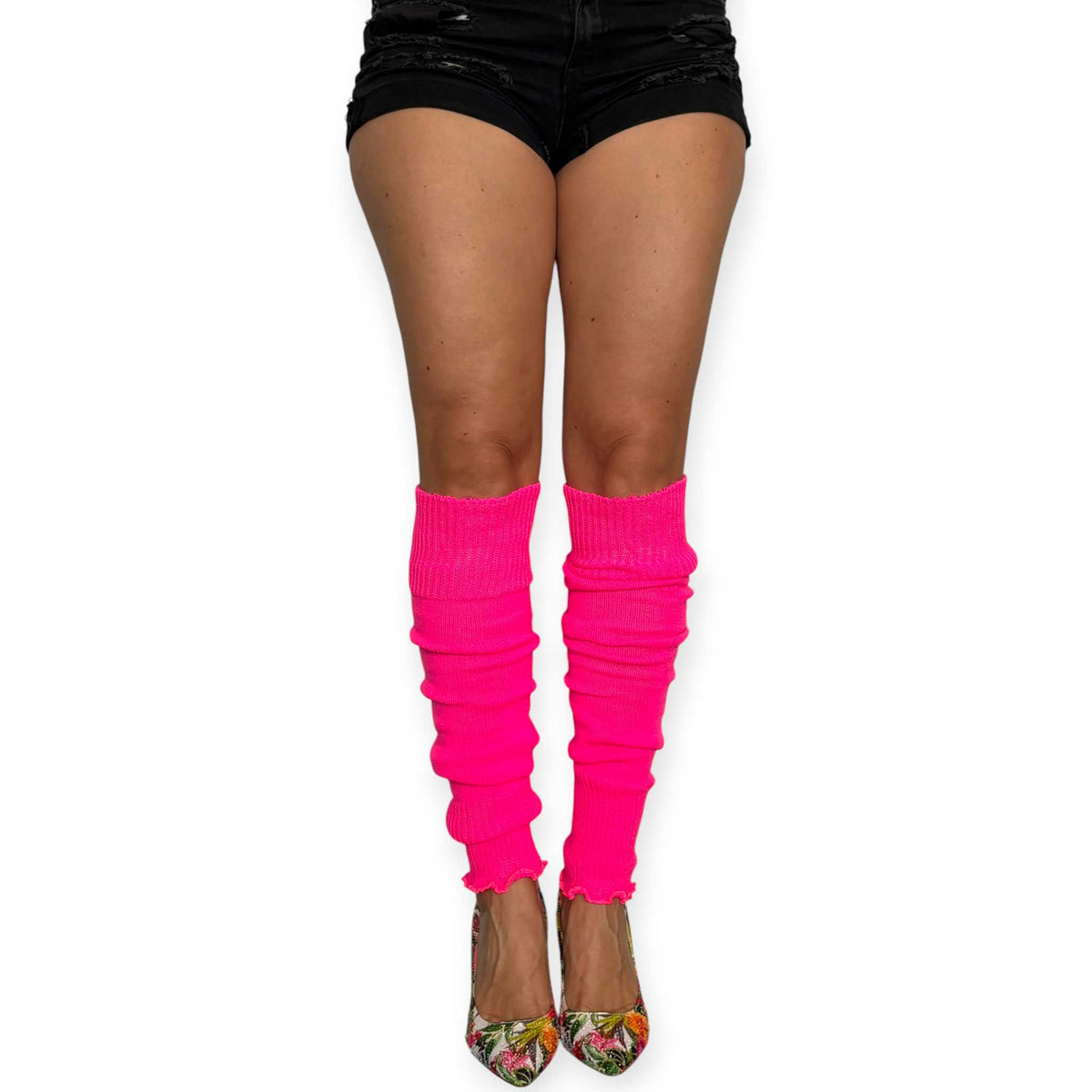 Bright pink leg warmers worn with heels for a bold fashion look.