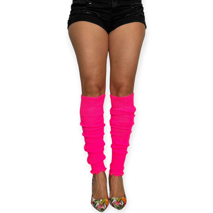 Bright pink leg warmers worn with heels for a bold fashion look.