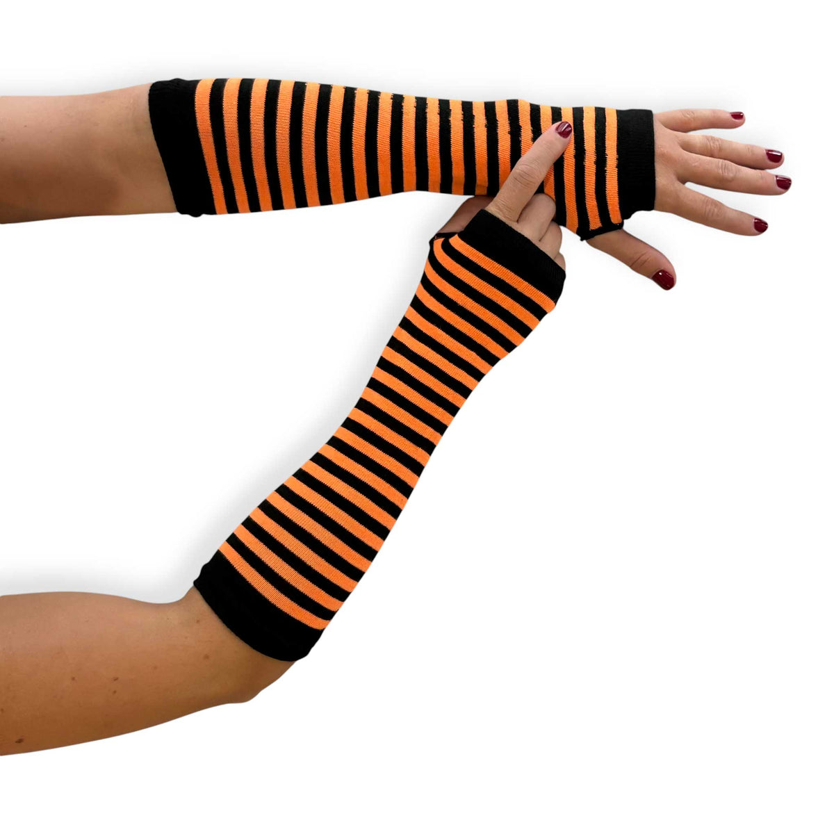 Orange and black striped fingerless gloves for women by Malka Chic with long arm warmer styling.
