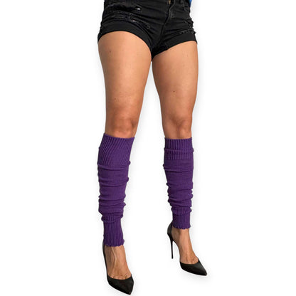 Purple knitted leg warmers paired with black shorts and heels.