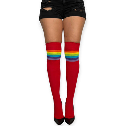 Red over the knee socks for women by Malka Chic with rainbow stripes at the top, styled with black shorts and heels.