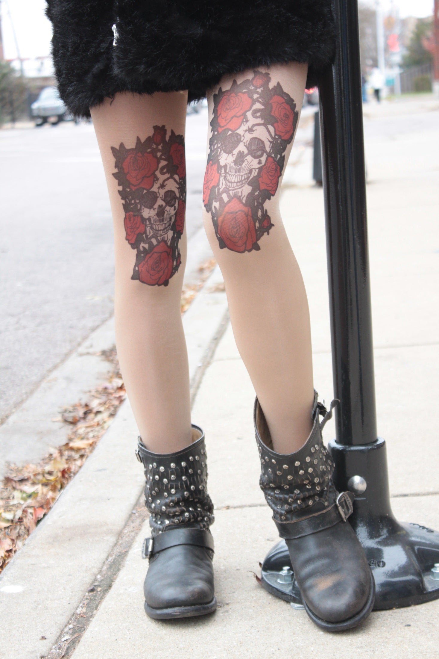 Person wearing black studded boots andSkull and Roses Sheer Tattoo Tights For women sold at Malka Chic