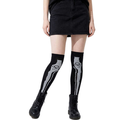 Black knee-high socks featuring realistic skeleton leg bones for Halloween and gothic fashion.