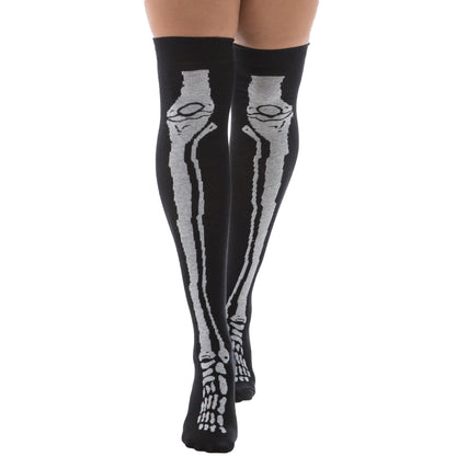 Woman wearing black over-the-knee socks with white skeleton bone design by Malka Chic.