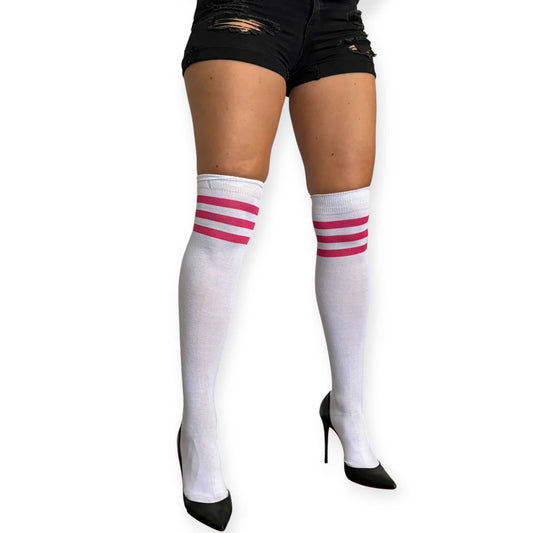 White and pink striped over the knee socks for women by Malka Chic styled with black shorts and pointed heels.