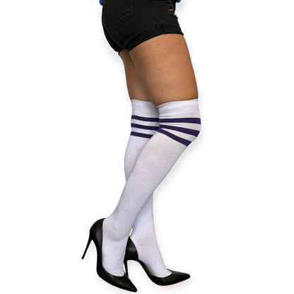 White over the knee socks for women by Malka Chic with purple stripe detail, styled with black shorts and pointed heels.
